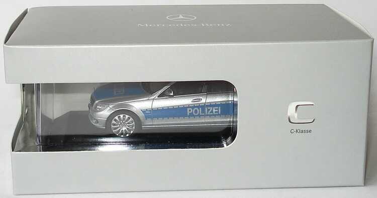Foto 1:43 Mercedes-Benz C-Klasse T-Modell Elegance (S204) Polizei iridiumsilbermet./blau Werbemodell Schuco B66960329