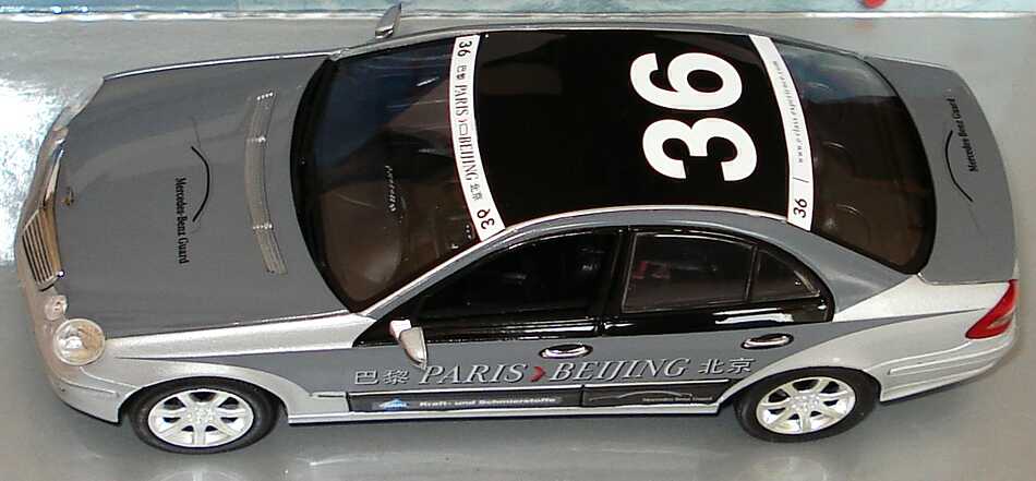 Foto 1:43 Mercedes-Benz E-Klasse Facelift (W211) Rallye Paris-Peking Team Mercedes-Benz Guard Nr.36 Werbemodell Minichamps B66962270