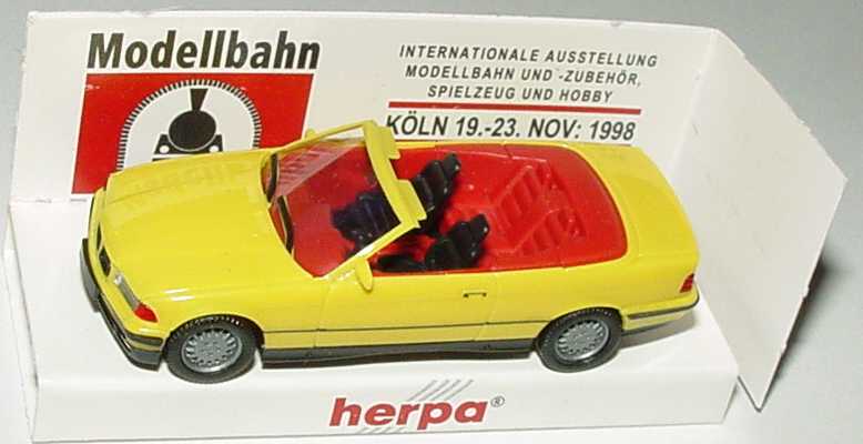 Foto 1:87 BMW 325i (E36) Cabrio gelb, IA rot Modellbahn Köln 1998 herpa