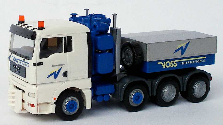 Foto 1:87 MAN TG-A XL 4a Schwerlastzugmaschine Voss International (Intermodellbau 2004) herpa 269308