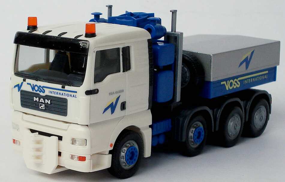 Foto 1:87 MAN TG-A XL 4a Schwerlastzugmaschine Voss International (Intermodellbau 2004) herpa 269308