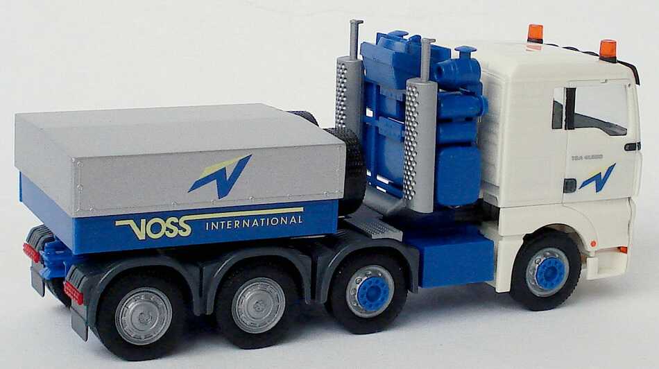 Foto 1:87 MAN TG-A XL 4a Schwerlastzugmaschine Voss International (Intermodellbau 2004) herpa 269308