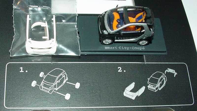 Foto 1:87 MCC Smart City-Coupé jack-black/silber-met. + Bodypanels in lite white Werbemodell Busch 0004832V000C08Q00