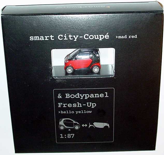 Foto 1:87 MCC Smart City-Coupé mad-red/schwarz + Bodypanels in hello-yellow Werbemodell Busch 0004832V000C07Q00