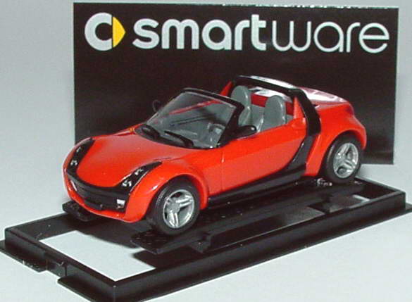 Foto 1:87 MCC Smart Roadster mad-red, Scheinwerfereinfassung schwarz Werbemodell Busch 0013097V003000000