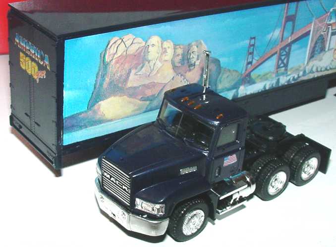 Foto 1:87 Mack CH600 (K) MovingVanSzg 3/2 America 500 years, Monuments herpa 140843