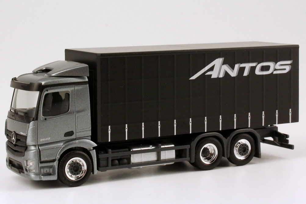 Foto 1:87 Mercedes-Benz Antos 3a GP-Lkw andorit-grau-met. Werbemodell - herpa B6 600 4091