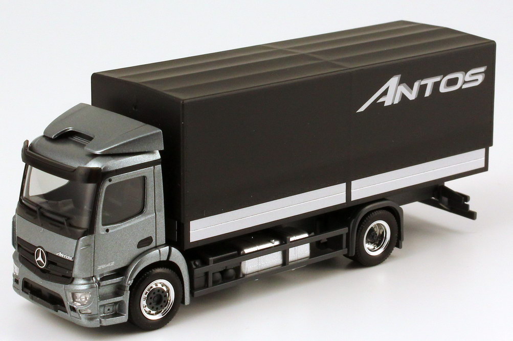 Foto 1:87 Mercedes-Benz Antos Pritsche/Plane andorit-grau-met. Werbemodell - herpa B66004090