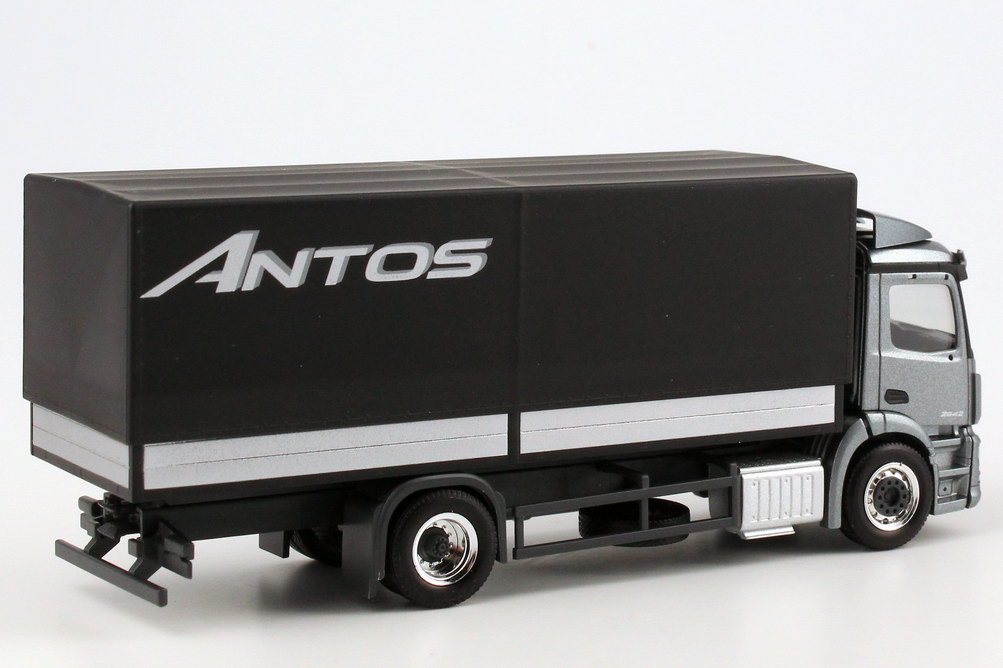 Foto 1:87 Mercedes-Benz Antos Pritsche/Plane andorit-grau-met. Werbemodell - herpa B66004090