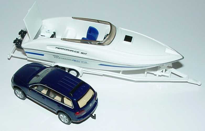 Foto 1:87 VW Touareg ravennablau-met. mit Speedboot Performance 807 Werbemodell Wiking 7L0099301A